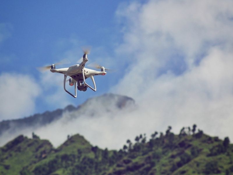 LiDAR Mapping Hillside Lots Dense Brush San Diego California | San Diego Land Surveying Drone capturing hillside terrain data for LiDAR mapping on a brush covered property in San Diego California